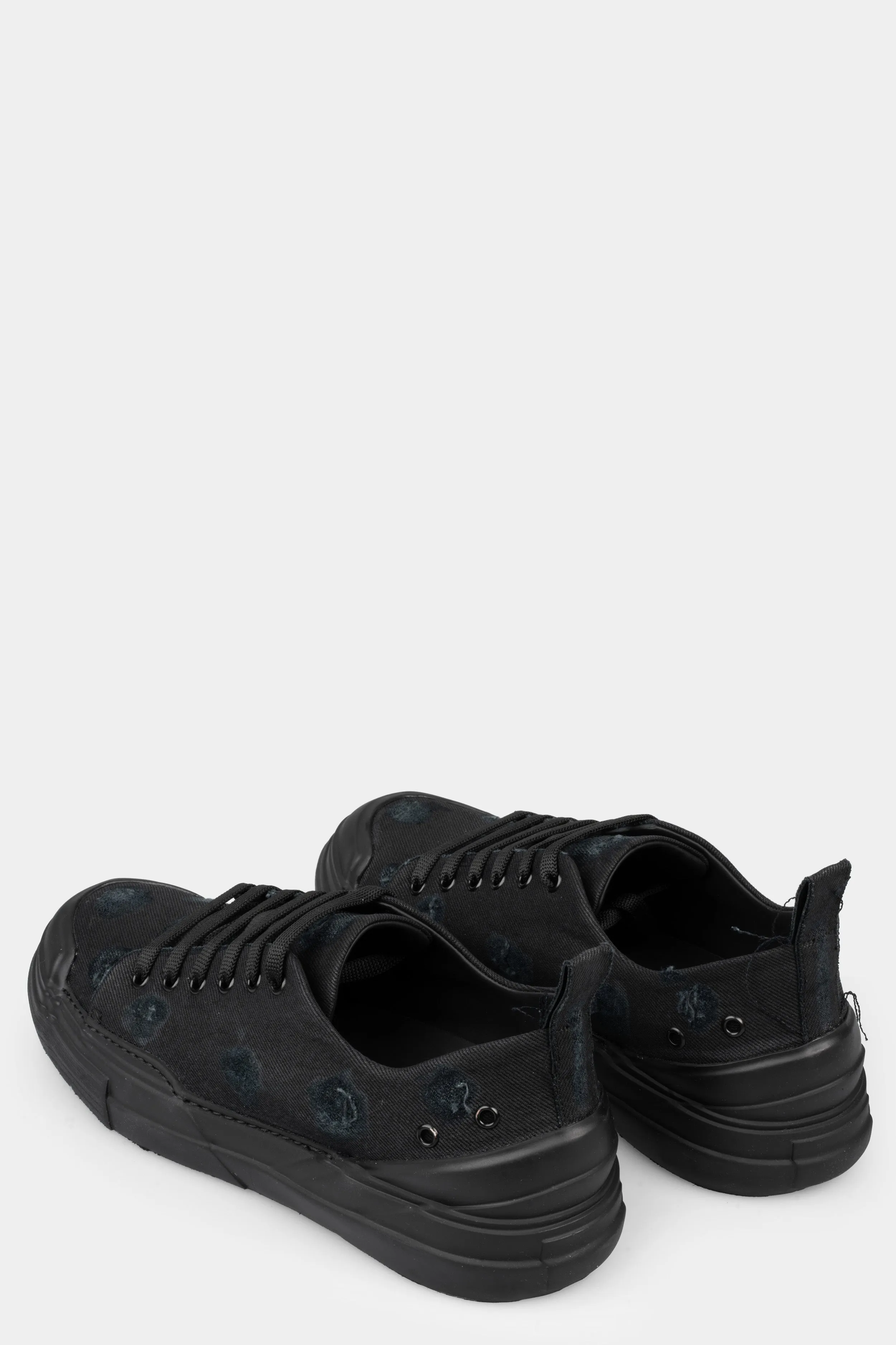 Distressed denim sneakers