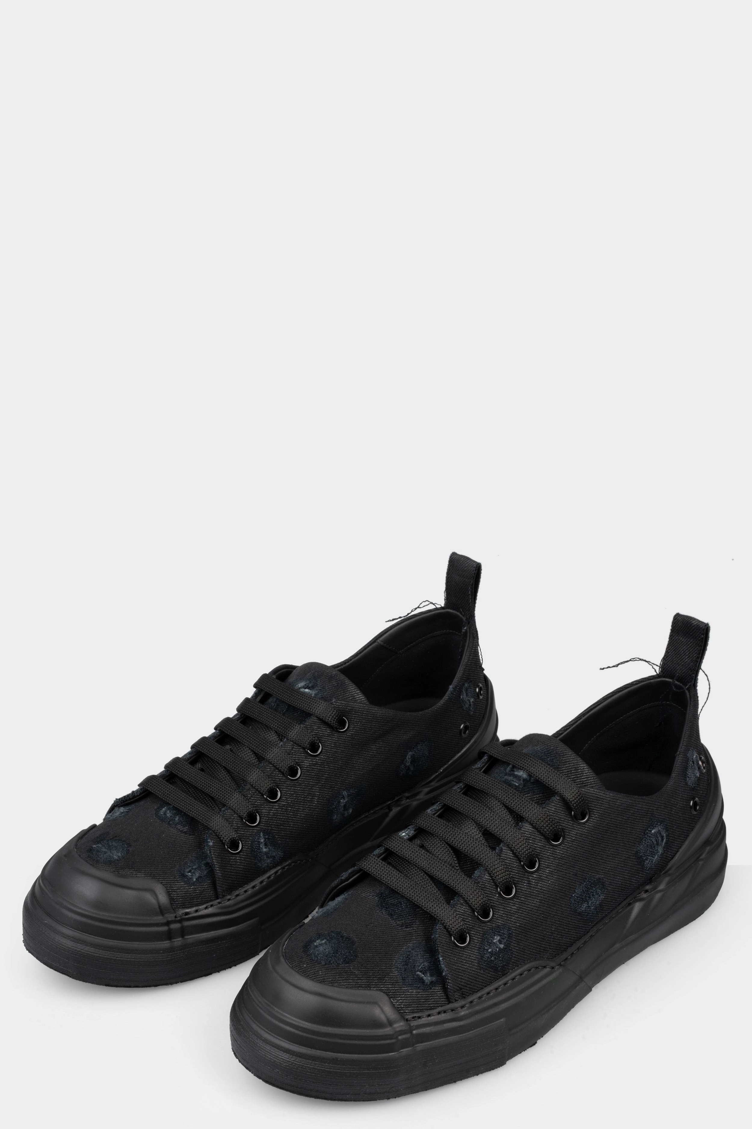 Distressed denim sneakers