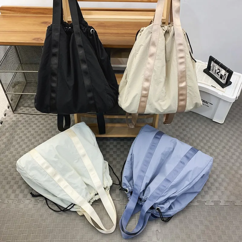 Solid color nylon fabric hand-held backpack 