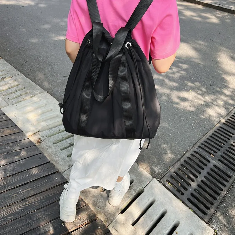 Solid color nylon fabric hand-held backpack