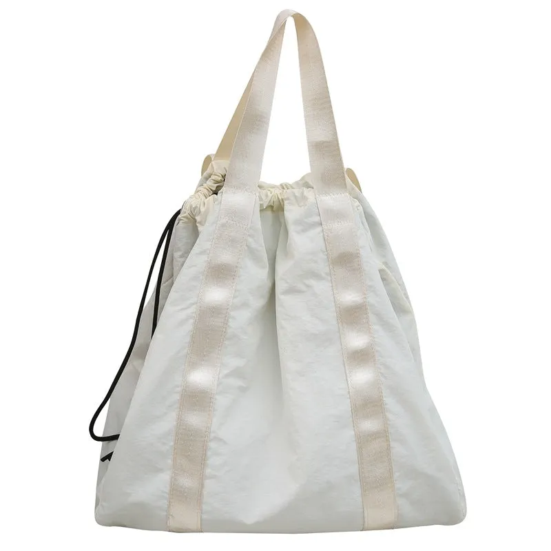 Solid color nylon fabric hand-held backpack