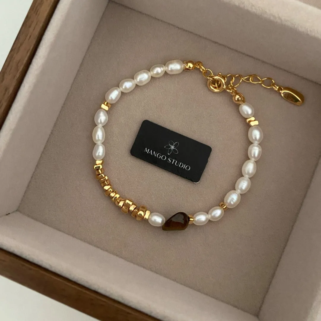 Wholesale Rice-grain pearl tiger eye stone small fresh and high-end adjustable bracelet light_wish_jewels